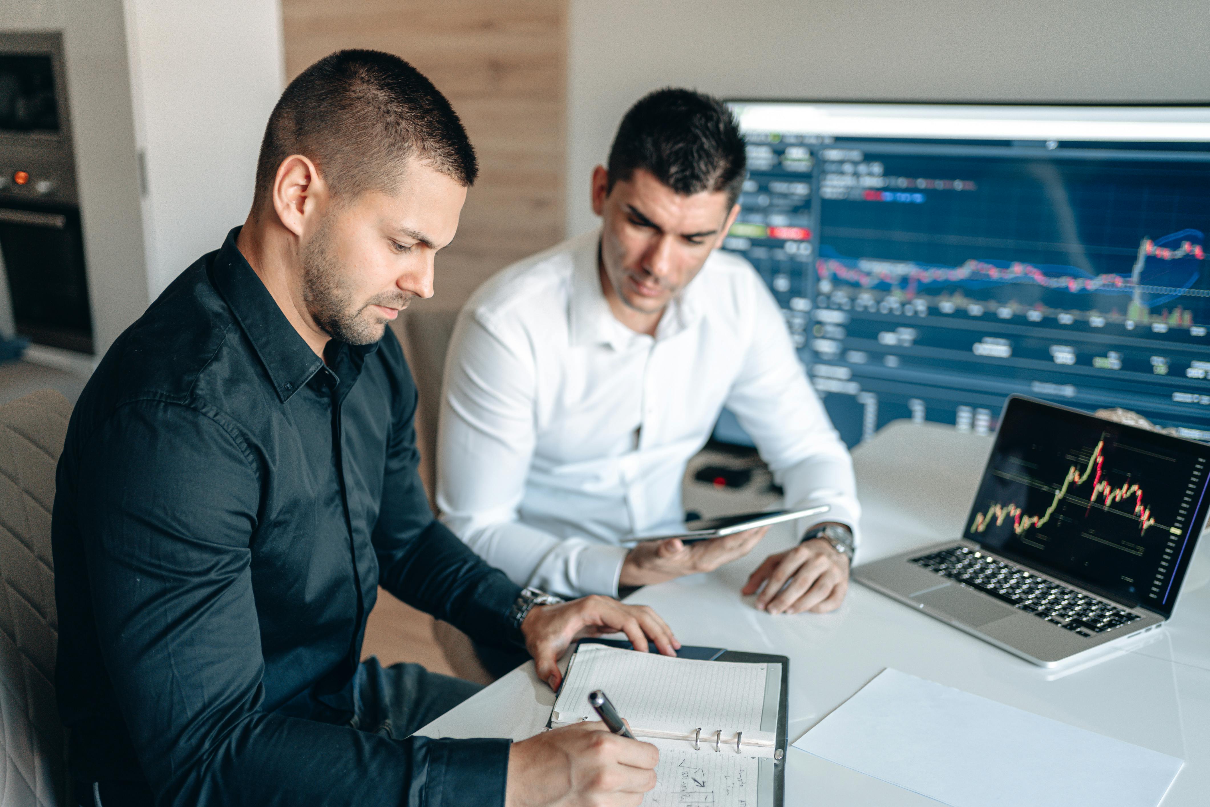Two professionals discussing financial matters